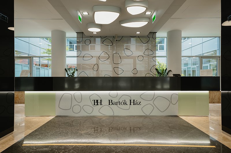  This picture shows the inside of the Bartok Haz building in Budapest. You can see the entrance area.